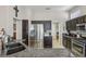 A kitchen features stainless steel appliances, dark wood cabinets, and granite countertops at 10428 Villa Ridge Dr, Las Vegas, NV 89134