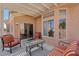 Comfortable covered patio with shaded seating, perfect for enjoying warm afternoons at 10428 Villa Ridge Dr, Las Vegas, NV 89134