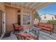 Inviting covered patio with comfortable seating, ideal for outdoor relaxation and entertaining at 10428 Villa Ridge Dr, Las Vegas, NV 89134