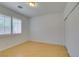 Bright bedroom with hardwood floors, white walls, a window with plantation shutters and closet at 10513 Shanna Trellis Ave, Las Vegas, NV 89144
