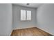 Bedroom features wood floors and window with wood shutter blinds at 10513 Shanna Trellis Ave, Las Vegas, NV 89144