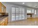 Dining area featuring tile floors, lots of light and decorative granite backsplash at 10513 Shanna Trellis Ave, Las Vegas, NV 89144