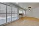 Dining area with tile floors, fireplace and light from the sliding glass doors at 10513 Shanna Trellis Ave, Las Vegas, NV 89144