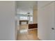 Hallway leading to a living room featuring a decorative fireplace and abundant natural light at 10513 Shanna Trellis Ave, Las Vegas, NV 89144