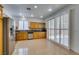 Bright kitchen features stainless appliances, ample cabinets, and sliding doors to the backyard at 10513 Shanna Trellis Ave, Las Vegas, NV 89144