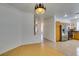 Hallway view of kitchen featuring stainless steel appliances and wood cabinetry at 10513 Shanna Trellis Ave, Las Vegas, NV 89144