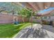 Inviting backyard with synthetic lawn, play structure, and outdoor grill setup at 1069 Aspen Cliff Dr, Henderson, NV 89011