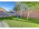 A backyard featuring lush artificial turf and a charming playground, perfect for Gathering fun at 1069 Aspen Cliff Dr, Henderson, NV 89011
