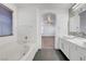 Bright bathroom featuring a modern soaking tub, double sinks, and window at 1069 Aspen Cliff Dr, Henderson, NV 89011