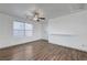 Spacious bedroom with wood-look floors and a ceiling fan for added comfort at 1069 Aspen Cliff Dr, Henderson, NV 89011