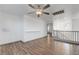 Loft area with laminate floors and natural light features, plus access to other rooms at 1069 Aspen Cliff Dr, Henderson, NV 89011