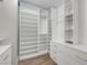 Spacious walk-in closet with custom shelving and wood floors at 1069 Aspen Cliff Dr, Henderson, NV 89011