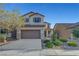 Charming two-story home with a well-manicured front yard and attached two-car garage, perfect for suburban living at 1069 Aspen Cliff Dr, Henderson, NV 89011