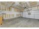 Unfinished garage features painted walls, concrete floor, and storage racks at 1069 Aspen Cliff Dr, Henderson, NV 89011