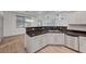Modern kitchen features stainless steel appliances, sleek cabinets, and stone countertops at 1069 Aspen Cliff Dr, Henderson, NV 89011