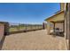 Private backyard with desert landscaping, an iron fence, and a covered patio for outdoor enjoyment at 12093 Glentana View St, Las Vegas, NV 89138