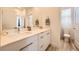 Bright bathroom with double vanity, modern fixtures, and a separate toilet room at 12093 Glentana View St, Las Vegas, NV 89138