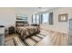 Stylish bedroom features wood-look floors, contemporary decor and plenty of natural light at 12093 Glentana View St, Las Vegas, NV 89138