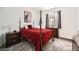 Cozy bedroom with plush carpeting, a four-poster bed and complementary furniture pieces at 12093 Glentana View St, Las Vegas, NV 89138