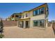 Two-story home showcasing stucco siding, a tile roof, and a covered patio in the private backyard at 12093 Glentana View St, Las Vegas, NV 89138