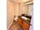 Bathroom with tile floors, granite counters, and wood cabinets at 1333 Pacific Terrace Dr, Las Vegas, NV 89128