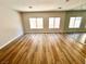 Bedroom with hardwood floors and two windows for natural light at 1333 Pacific Terrace Dr, Las Vegas, NV 89128