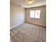 This cozy bedroom is carpeted and has a window providing natural light at 1333 Pacific Terrace Dr, Las Vegas, NV 89128