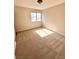 Bright bedroom with neutral carpet and a window at 1333 Pacific Terrace Dr, Las Vegas, NV 89128