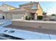 Inviting two-story home featuring a well-manicured front yard and neutral color palette at 1333 Pacific Terrace Dr, Las Vegas, NV 89128