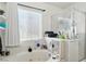 Bright bathroom featuring a tub, shower with glass doors, and a large window at 135 Cadrow Castle Ct, Las Vegas, NV 89148