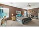 Comfortable bedroom with carpet floors, a ceiling fan, and stylish decor at 135 Cadrow Castle Ct, Las Vegas, NV 89148