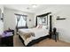 Bright bedroom featuring a comfortable bed, carpeted floors, and stylish curtains at 135 Cadrow Castle Ct, Las Vegas, NV 89148