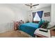 Cozy bedroom featuring carpet floors, a ceiling fan, and bright natural light at 135 Cadrow Castle Ct, Las Vegas, NV 89148