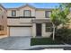 Charming two-story home with a well-manicured lawn and inviting curb appeal at 135 Cadrow Castle Ct, Las Vegas, NV 89148