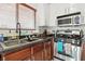 Well-lit kitchen features stainless steel appliances and modern cabinets at 135 Cadrow Castle Ct, Las Vegas, NV 89148