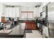 Bright kitchen with granite countertops, stainless steel appliances, and custom cabinets at 135 Cadrow Castle Ct, Las Vegas, NV 89148