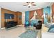 Comfortable living room features modern decor, wall-mounted TV, and tile flooring at 135 Cadrow Castle Ct, Las Vegas, NV 89148