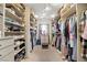Spacious walk-in closet with custom shelving and a variety of storage options for clothing and shoes at 135 Cadrow Castle Ct, Las Vegas, NV 89148
