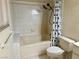 This bathroom has a tiled shower-tub combination and neutral colors at 1409 Santa Margarita St # B, Las Vegas, NV 89146
