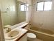This bathroom features a window for natural light and a tiled shower-tub combination at 1409 Santa Margarita St # B, Las Vegas, NV 89146