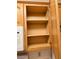 Kitchen cabinet with wood shelving, and natural wood door at 1409 Santa Margarita St # B, Las Vegas, NV 89146