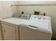 This laundry room includes a side-by-side washer and dryer for convenient chore days at 1409 Santa Margarita St # B, Las Vegas, NV 89146