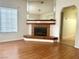 Living room featuring a fireplace, mirror and wood flooring at 1409 Santa Margarita St # B, Las Vegas, NV 89146