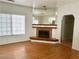 The spacious living room features laminate flooring, a fireplace, and a mirrored wall at 1409 Santa Margarita St # B, Las Vegas, NV 89146