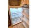 Clean, empty refrigerator with clear shelving ready for use at 1409 Santa Margarita St # B, Las Vegas, NV 89146