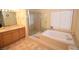 Bathroom features a soaking tub and a separate glass shower at 1700 Double Arrow Pl, Las Vegas, NV 89128