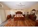 Large bedroom showcasing hardwood floors and a decorative plate display wall at 1700 Double Arrow Pl, Las Vegas, NV 89128