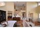 Elegant dining area with wood floors and a staircase leading to the second floor at 1700 Double Arrow Pl, Las Vegas, NV 89128