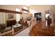 A spacious open-plan living space featuring wood floors and elegant furnishings at 1700 Double Arrow Pl, Las Vegas, NV 89128