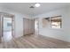 Bright bedroom featuring laminate floors, closet, and a large window offering natural light at 1808 E Saint Louis Ave, Las Vegas, NV 89104